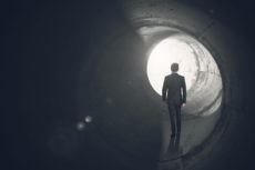 37727744 - determined businessman gets out of the tunnel