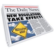 30365798 - new regulations take effect newspaper headline informing you of rules and laws impacting your life, business or career