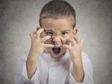 32078391 - closeup portrait angry child, boy screaming hysterical demanding, having nervous breakdown isolated grey wall background. negative human emotion facial expressions, body language, attitude, perception
