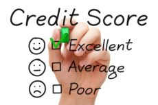23097404 - hand putting check mark with green marker on excellent credit score evaluation form.