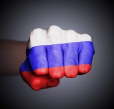 17733945 - front view of punching fist on gray background, flag of russia