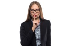 43695779 - image of businesswoman showing silence in glasses on white background