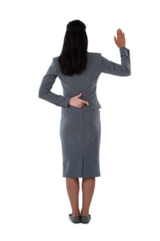 82494678 - rear view of businesswoman raising her hand against white background