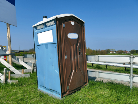 75961044 - transportable modern designed portable public street toilet is placed at building site, outdoor privacy
